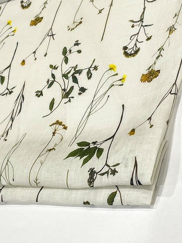 Lightweight white linen flat roman shade with botanical floral garden print featuring stems and flowers