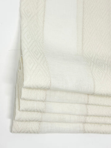 Wide sheer linen blend sheer flat roman shade with textured woven stripe pattern in off-white