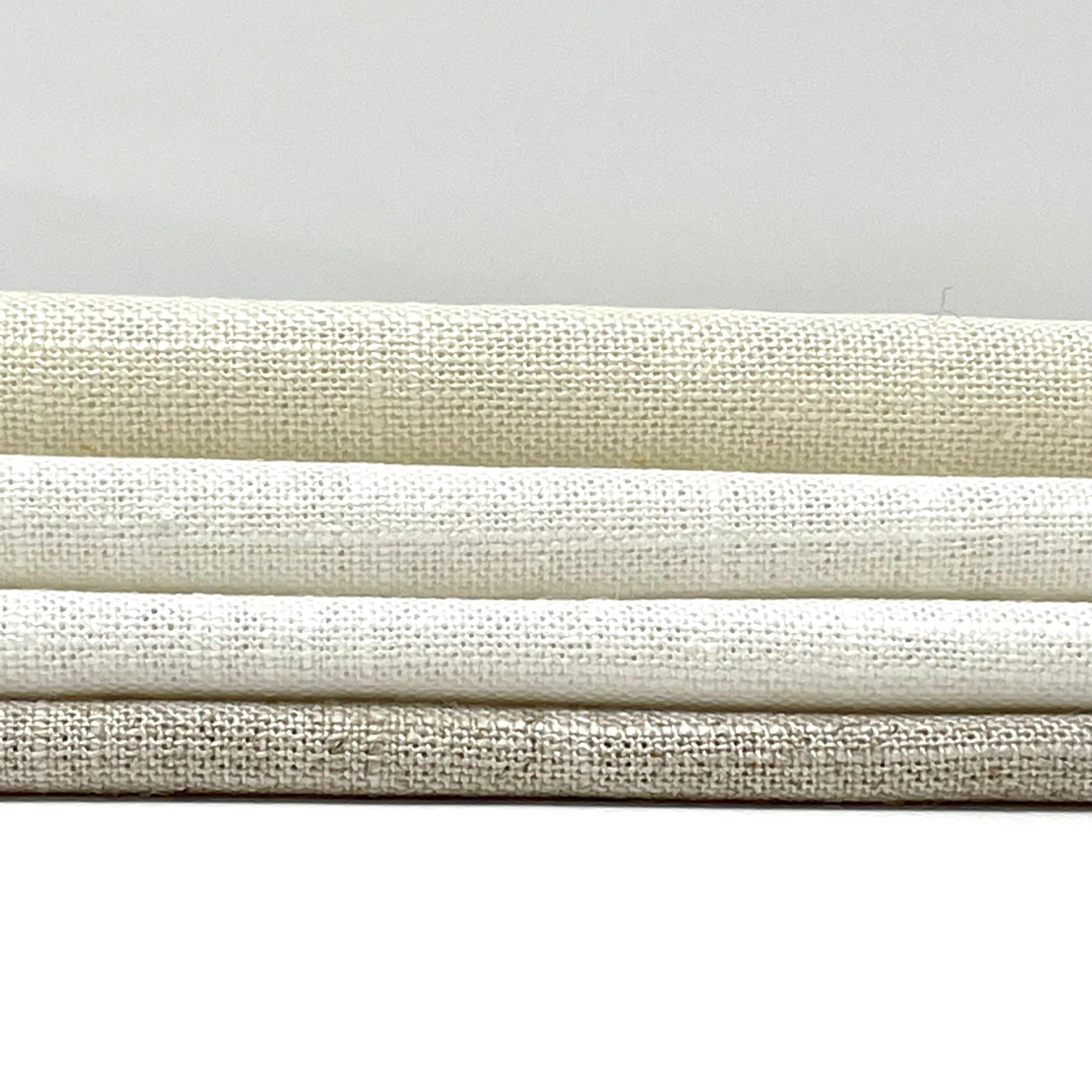 Three stacked layers of sheer net linen blend fabric in soft neutral tones, showcasing texture and weave.
