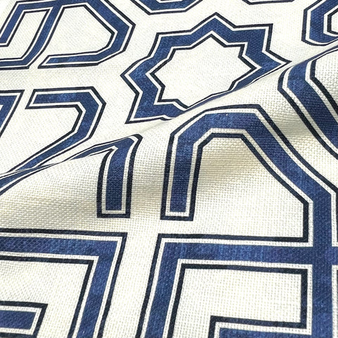 Linen blend fabric with bold blue geometric star pattern for home décor.