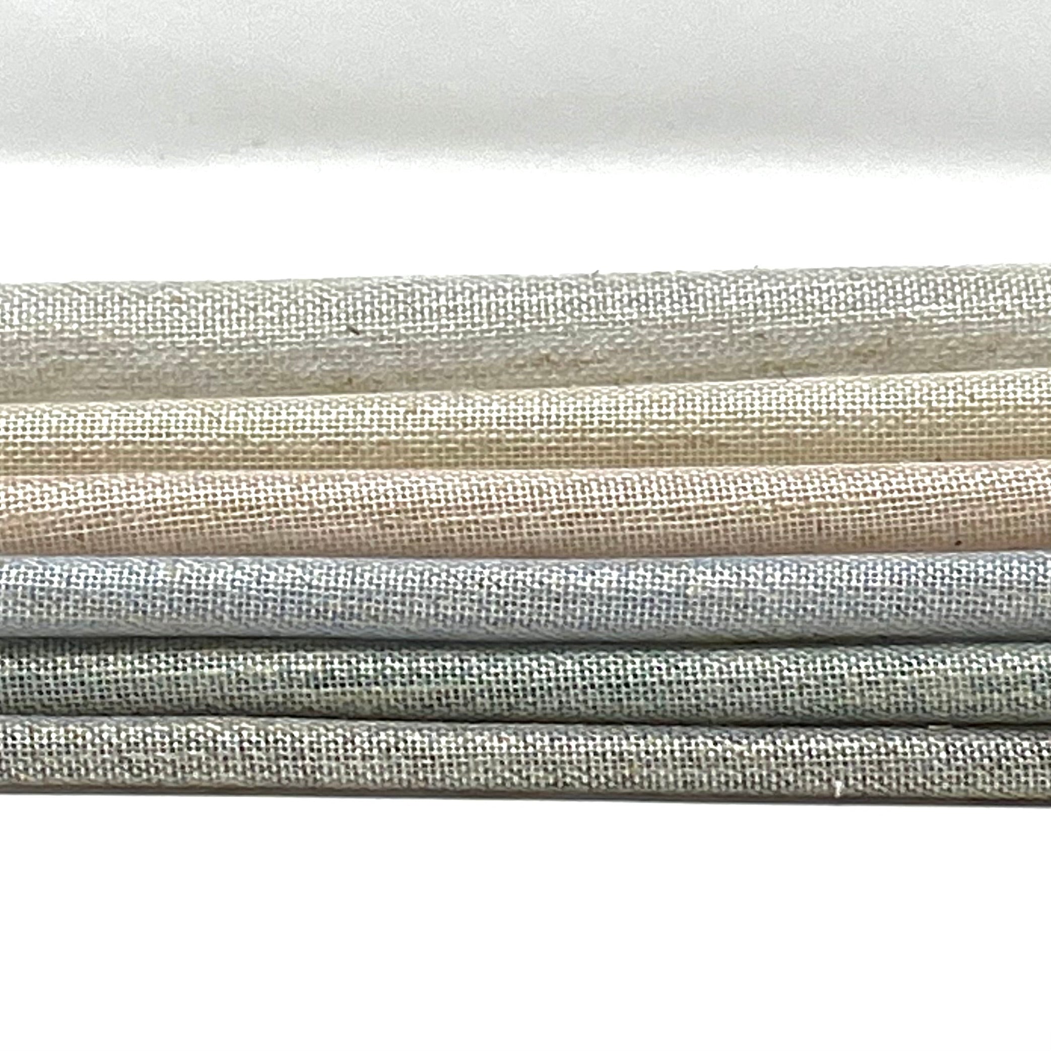 two-tone sheer linen blend fabric in gradient shades of grey, beige, and cream.