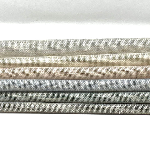 two-tone sheer linen blend fabric in gradient shades of grey, beige, and cream.