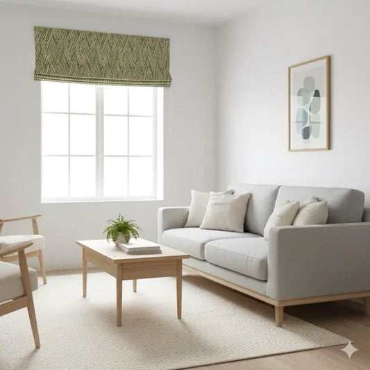 Modern living room with a gray sofa, wooden coffee table, and a geometric modern flat roman shade.