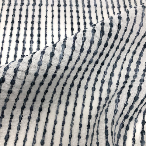 Close-up of sheer linen fabric with dark vertical embroidered stripes on a white background, style CL1032.