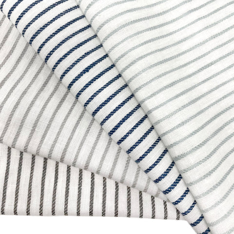 Striped 100% natural linen fabric in a 1/2" narrow stripe pattern, available in multiple shades. Ideal for curtains, drapery, table settings, and upholstery.