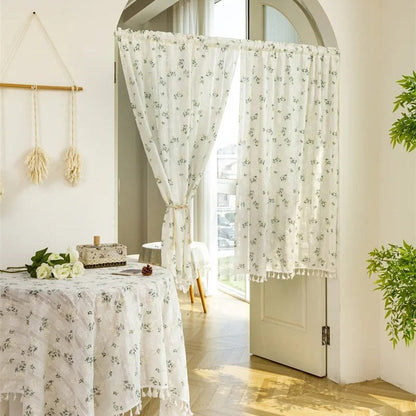 Cotton daisy café curtains on a glass door with matching table linen