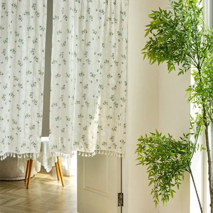 Cotton daisy café curtain pair hanging in a doorway with natural light