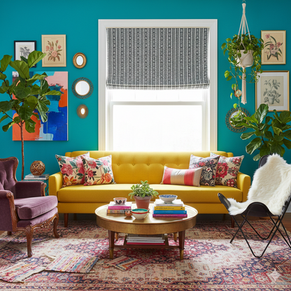 Living room with Aztec stripe linen roman shade, a yellow sofa, colorful pillows, and a blue wall.