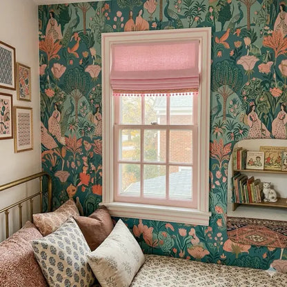 Room interior with floral wallpaper, window with pink roman shade and decorative pillows.