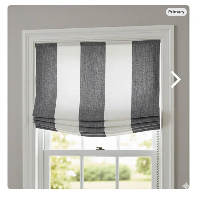Window with gray and white striped roman shade