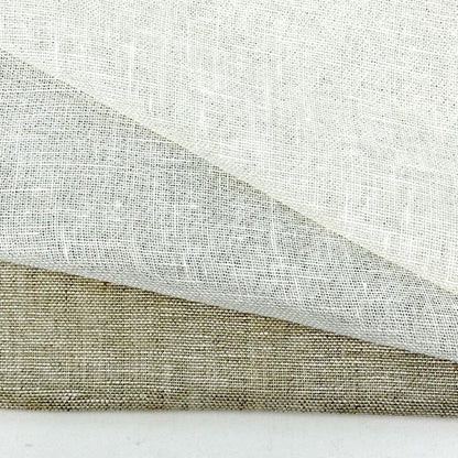 Sheer natural linen fabric in ivory, white and oatmeal draped in soft layers