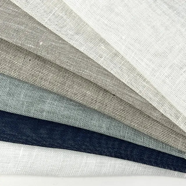 Open weave sheer linen fabric swatches fanned in all seven colors