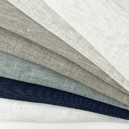 Open weave sheer linen fabric swatches fanned in all seven colors