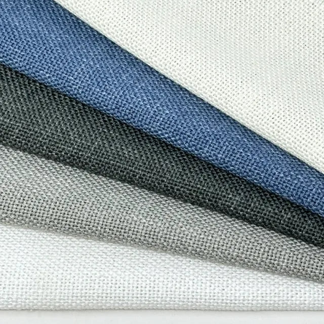 Close-up of fabric swatches in blue, gray, and white on a white background