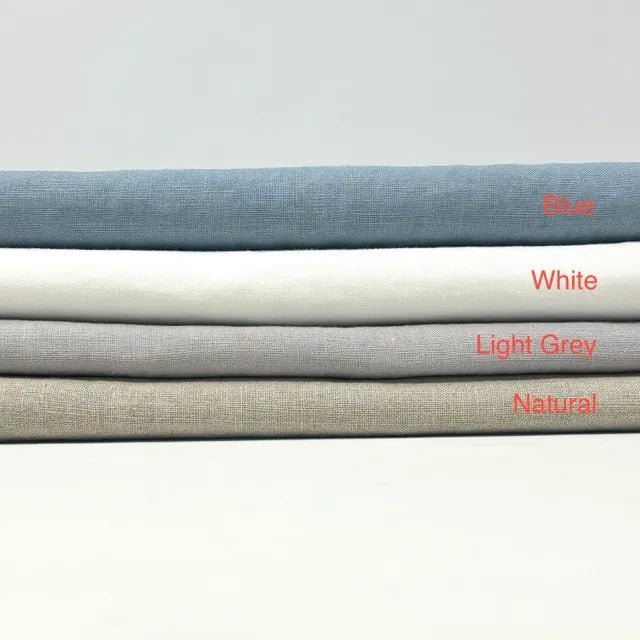 Four folded fabric swatches stacked horizontally on a light gray background, labeled from top to bottom as Blue, White, Light Grey, and Natural in red text.