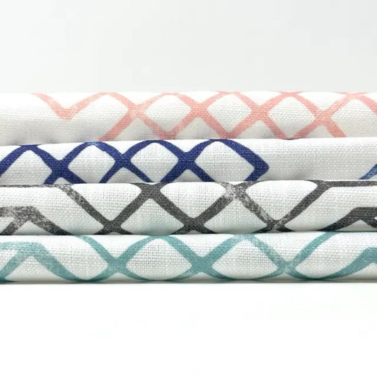 Four fabric swatches with different patterns on a white background
