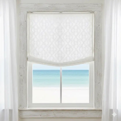 Window with Classic Woven Scroll Linen-Blend Sheer linen roman shade and view of ocean