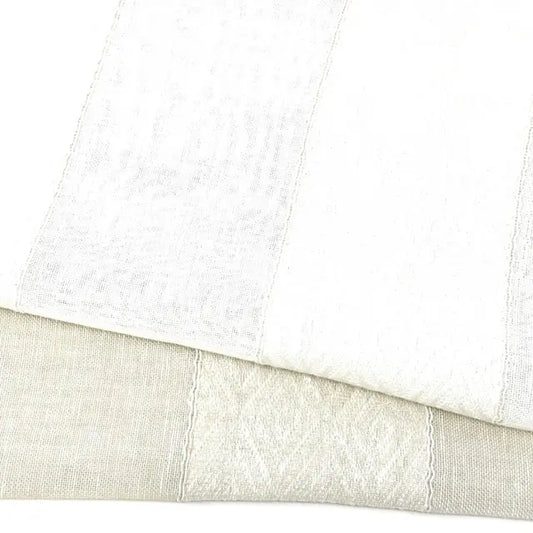 Close-up of white and beige textured linen fabric