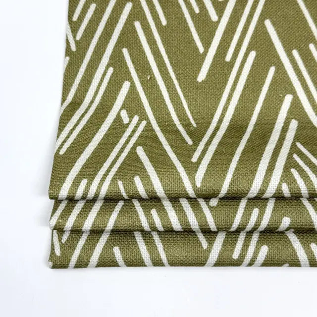 flat roman shade with green and white pattern on a white background