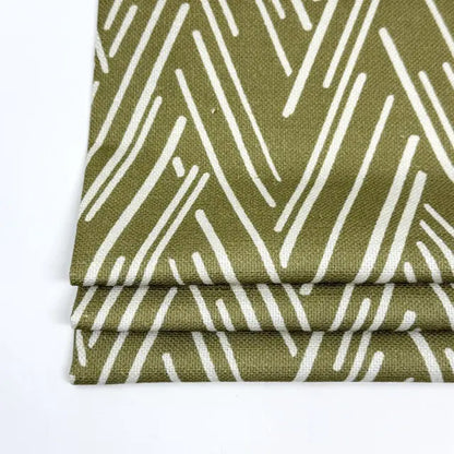 flat roman shade with green and white pattern on a white background