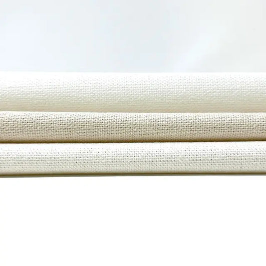 Three beige fabric swatches stacked on a white background