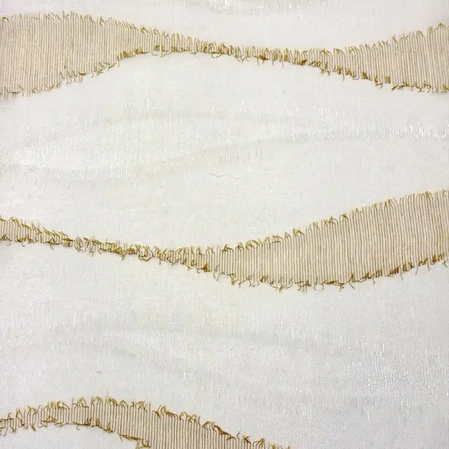 Decorative gold ribbon on a textured white background