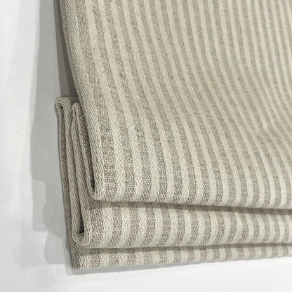 Folded fabric with a striped pattern on a white background