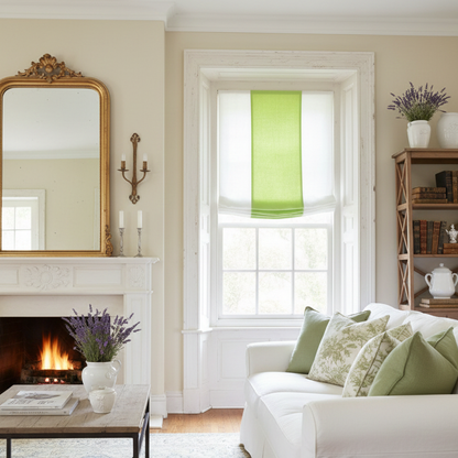 Living room with white sofa, fireplace, and window with green roman shade