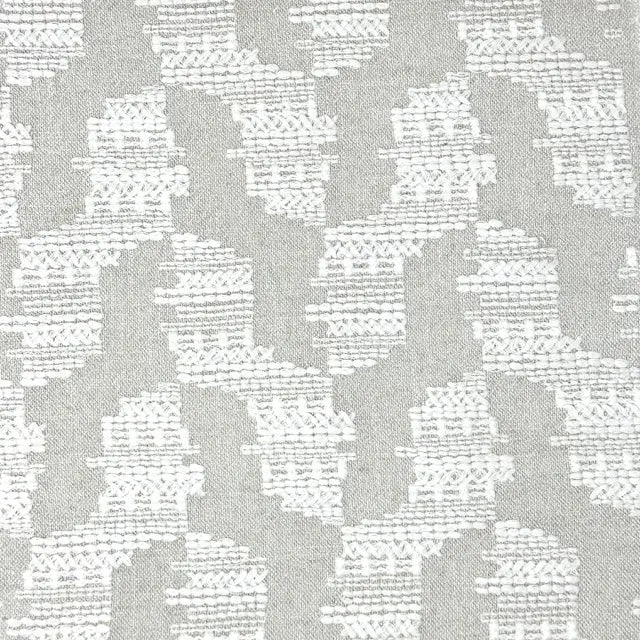 Gray and white geometric patterned fabric texture