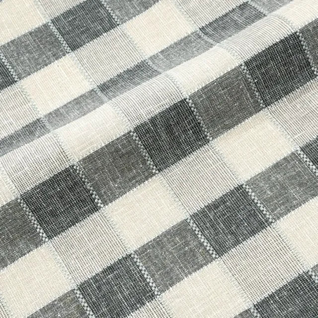 Close-up of a checkered fabric pattern with black and white squares.
