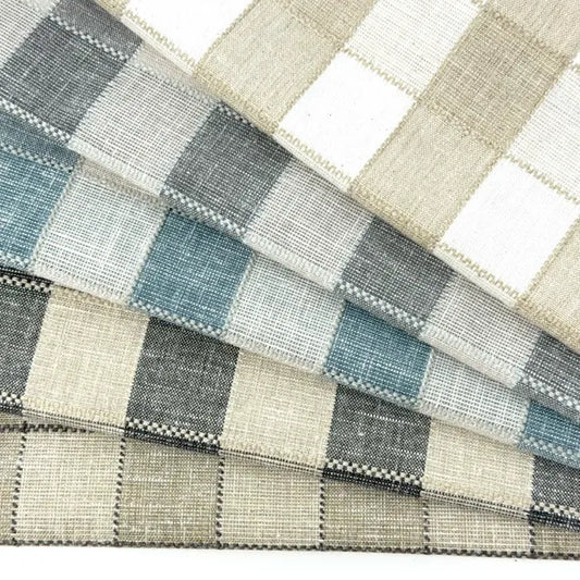 Fabric swatch with a checkered pattern in shades of blue, gray, and beige.