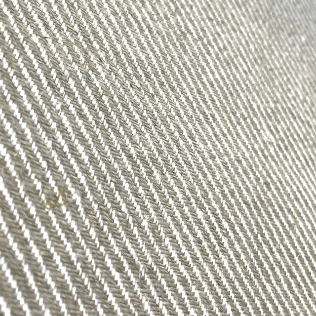 Close-up of a textured fabric with a diagonal pattern