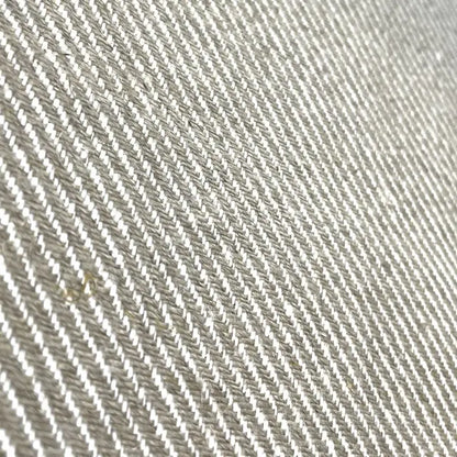 Close-up of a textured fabric with a diagonal pattern
