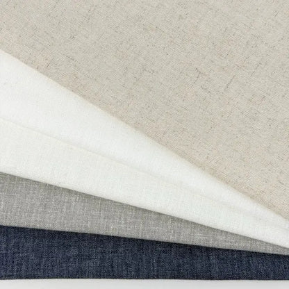 Four different fabric swatches in gray, white, and blue on a neutral background
