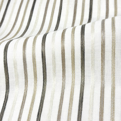 Close-up of fabric with vertical stripes in black, gray, and beige on a white background