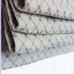 Folded fabric with a geometric pattern on a white background