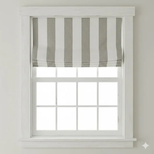 Window with a striped roman shade in a neutral setting