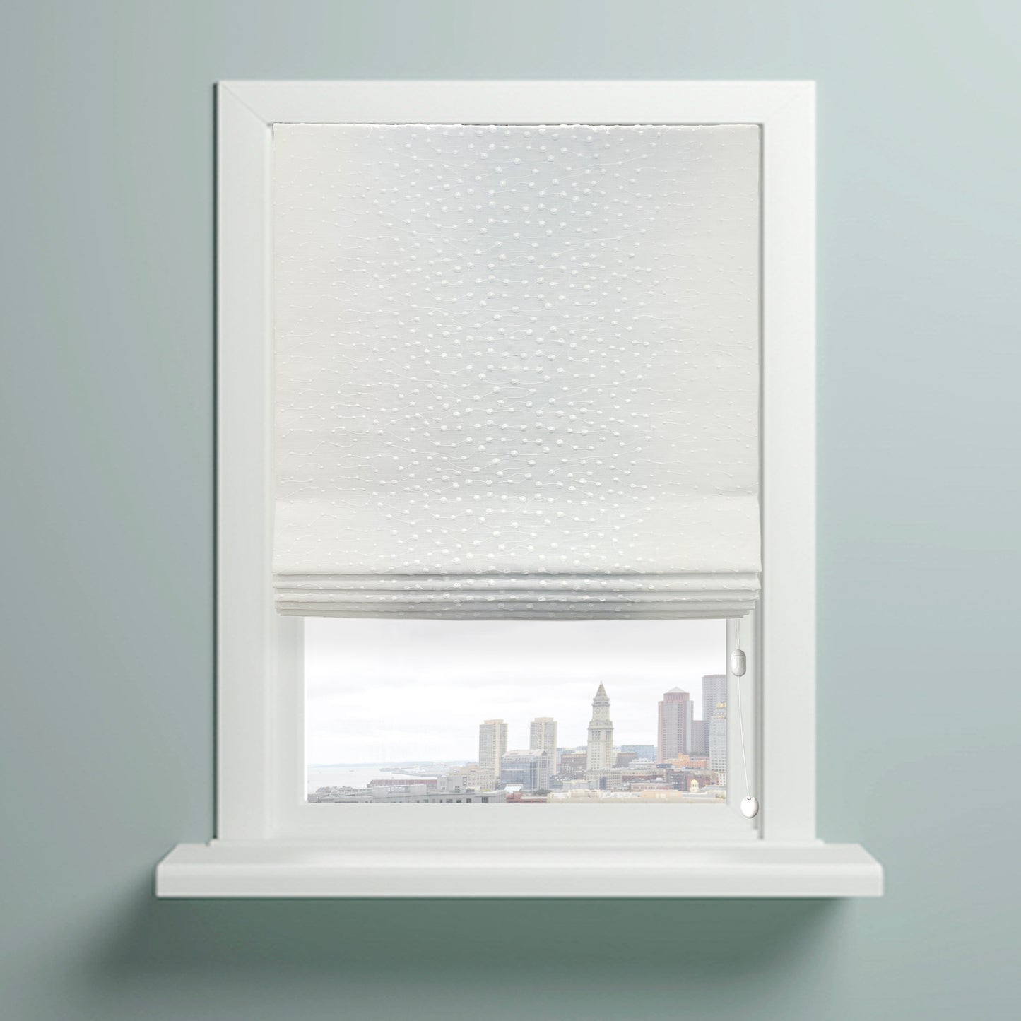 Elegant Embroidery Filigree Blend Linen flat roman shade on the window with a view of city.