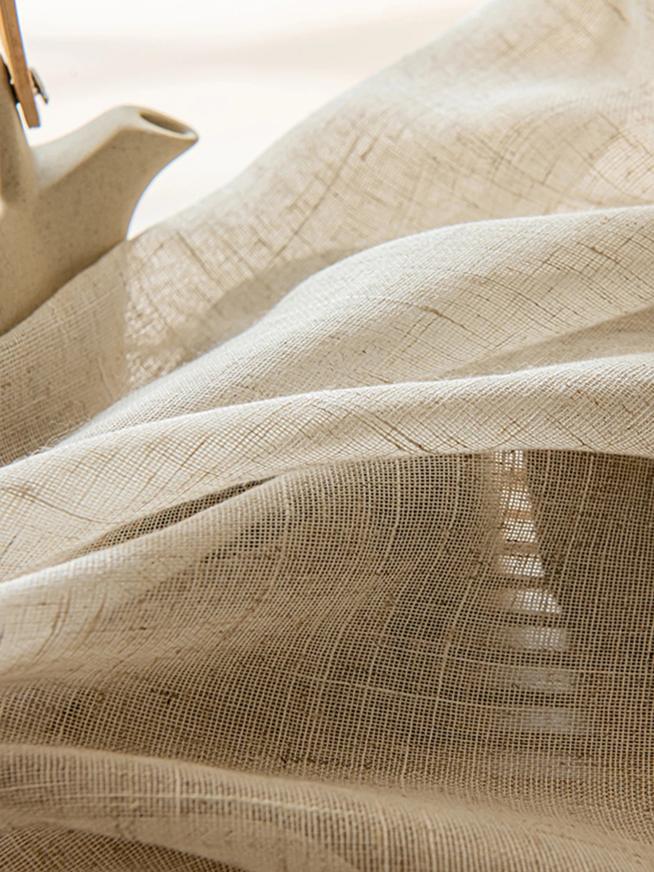 Close-up of beige fabric with a subtle pattern