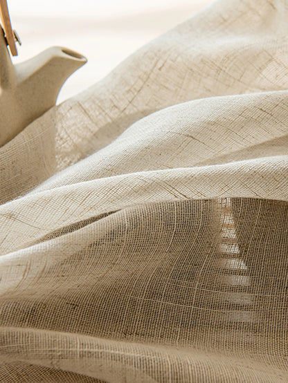 Close-up of beige fabric with a subtle pattern