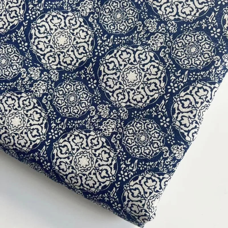 Navy blue fabric with white geometric pattern on a white background