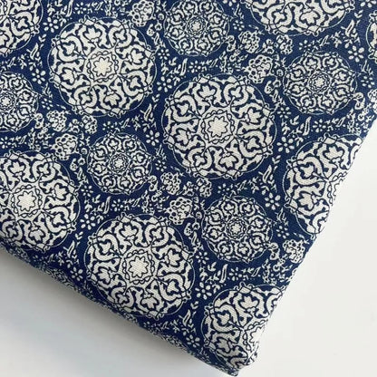 Navy blue fabric with white geometric pattern on a white background