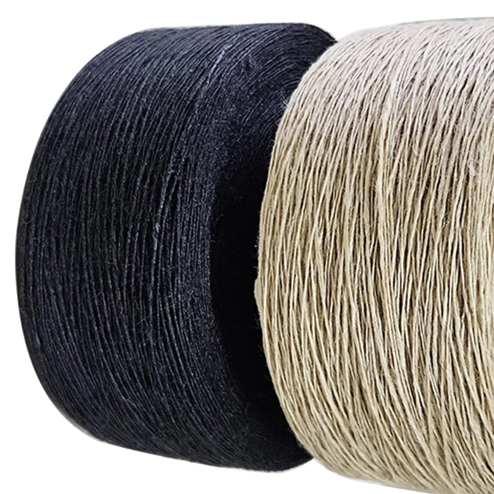 Two spools of braided cord or twine shown close up on a white background, one in black and one in light beige.