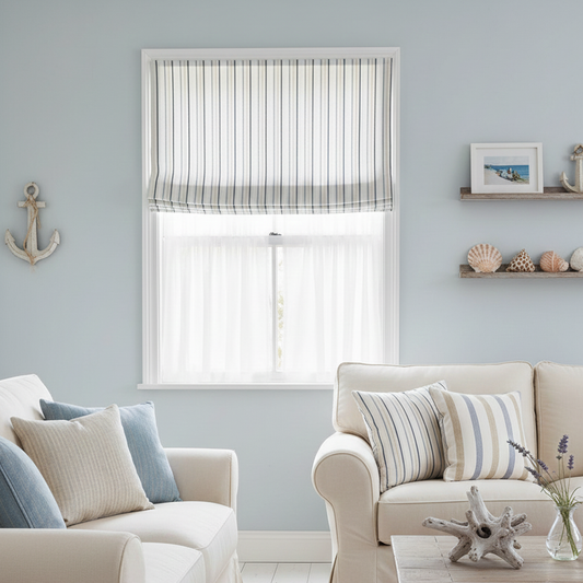 Living room with striped roman blinds, neutral decor, and coastal elements.