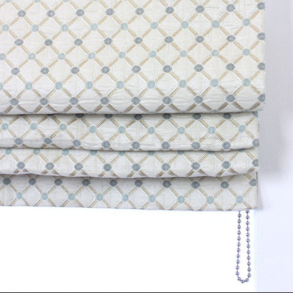 Patterned roman blind with geometric design on a white background