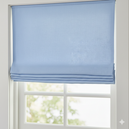 Blue roman shade on a window with a blurred outdoor background