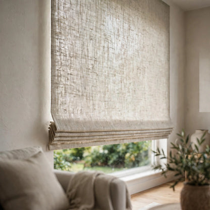 Natural open weave sheer linen flat Roman shade half raised in a bright living room