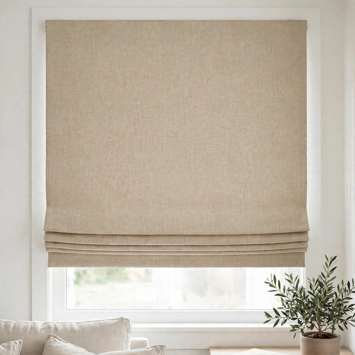 Oatmeal Belgian linen flat Roman shade half raised in a bright living room