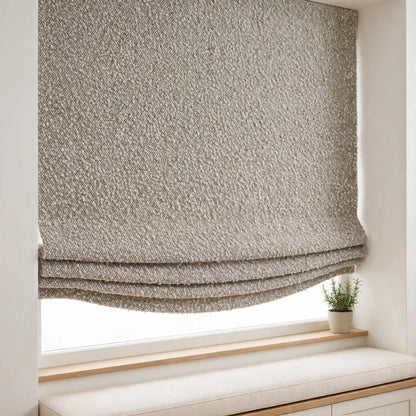 Pebble piling texture relaxed Roman shade with soft folds and a shallow curved bottom in a breakfast nook