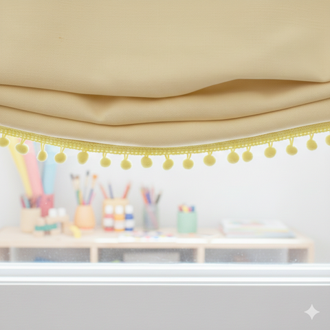 Decorative yellow pom-pom garland on a beige curtain with a blurred classroom background.